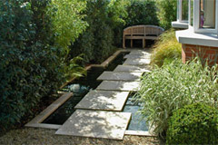 Slabs on pillars appear to float in this garden design in Dublin.