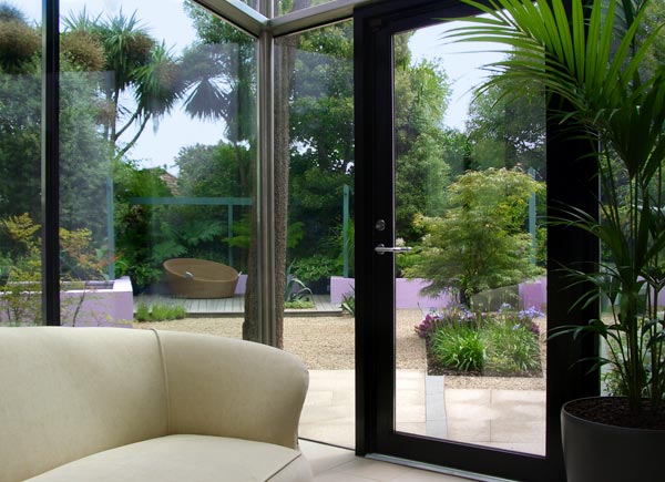 Large indoor plants and paving colour create a seamless flow.